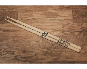 a pair of Joe's Master Series 5A American Hickory Drumsticks